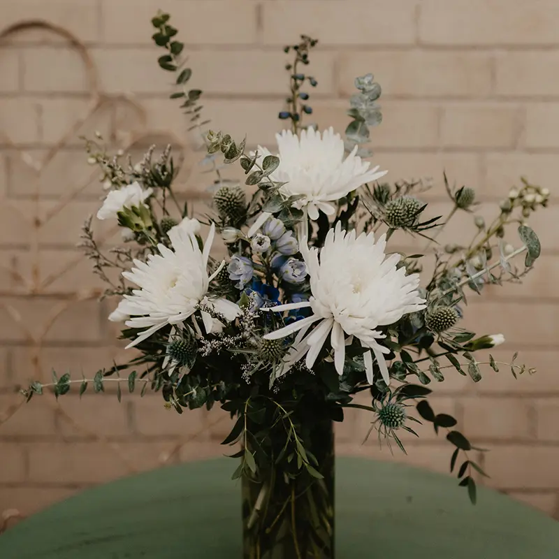 White flowers in a green vase